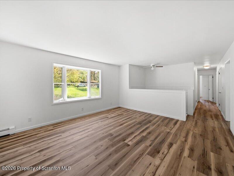 11 Padula Road Tunkhannock, PA 18657 - Photo 4 of 28 a view of an empty room with wooden floor and a window