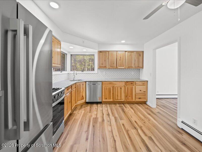 11 Padula Road Tunkhannock, PA 18657 - Photo 8 of 28 a kitchen with wooden floor and a window
