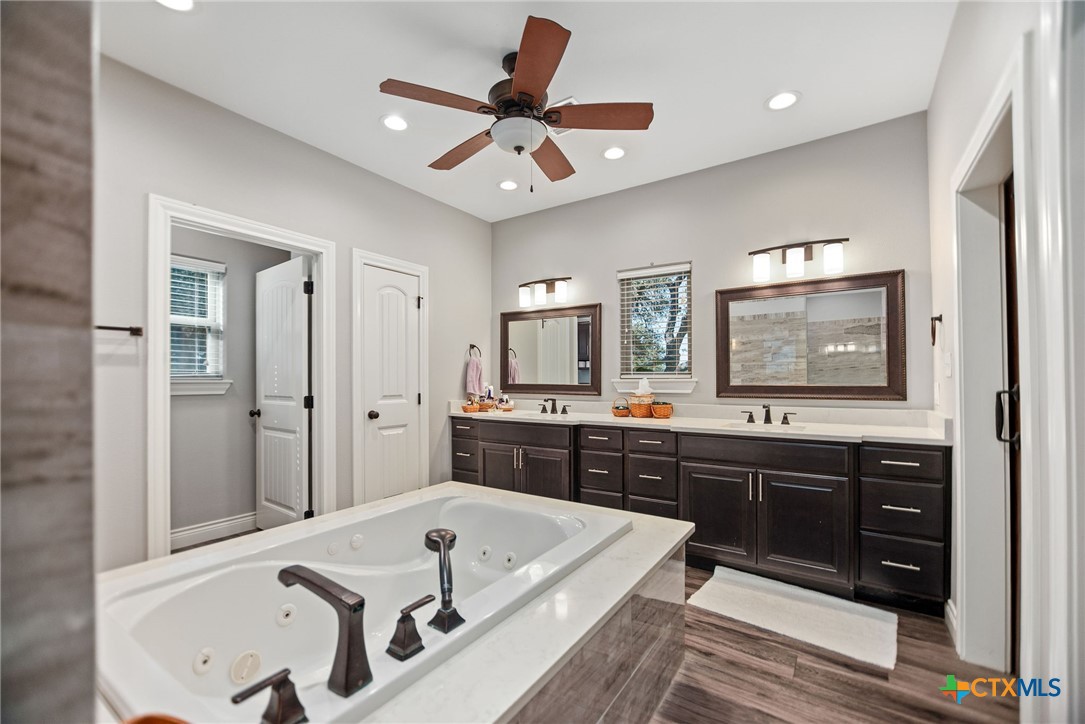 437 Bischoff Road Inez, TX 77968 - Photo 23 of 47 a large spacious bathroom with a tub sink shower and mirror