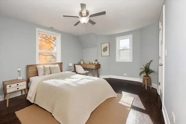 a bed room with a bed and a chandelier