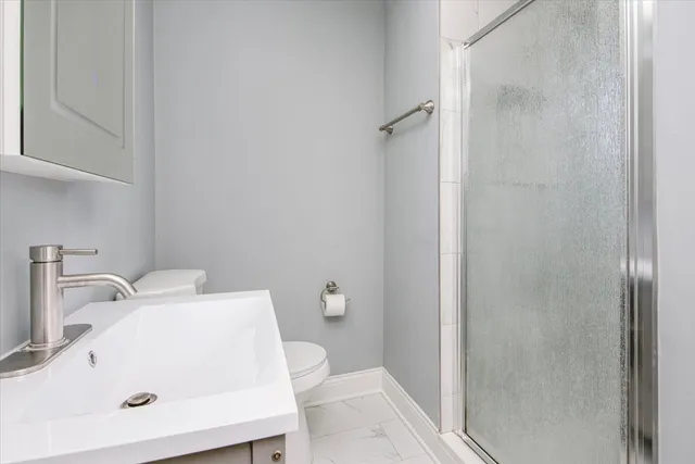 a bathroom with a sink and a toilet