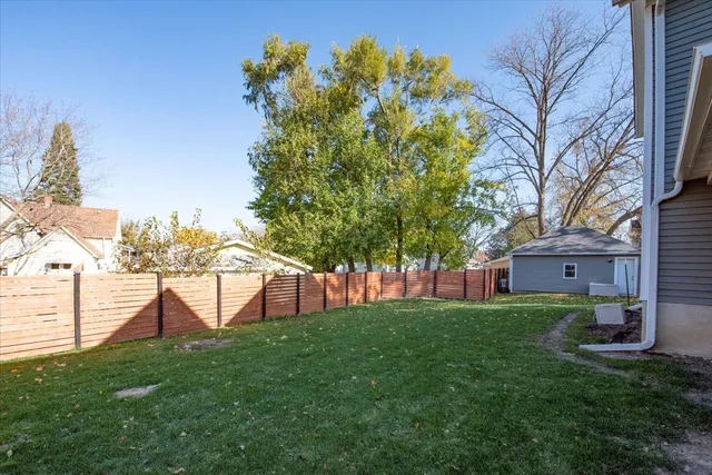 a view of a house with a backyard