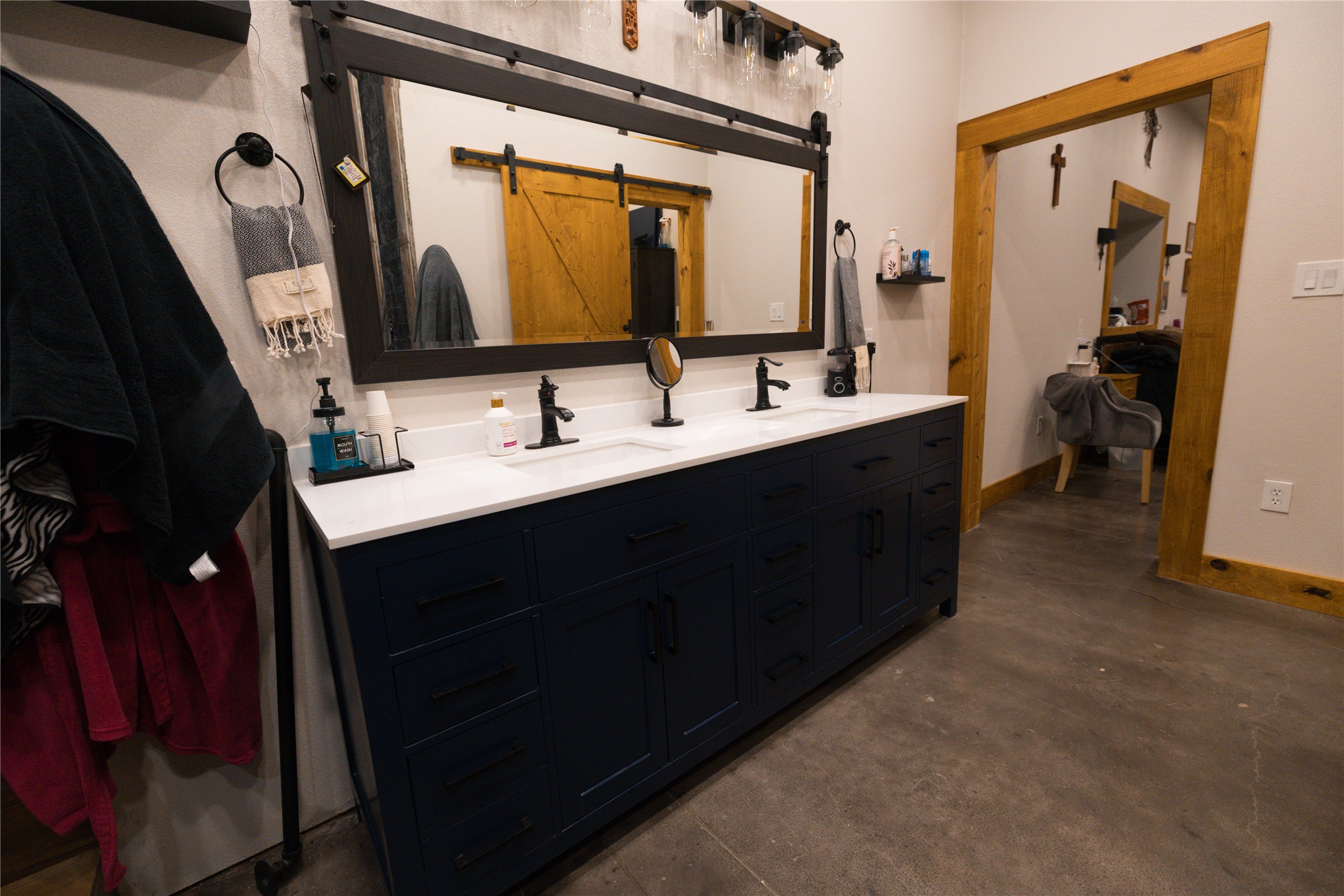 143 County Road Paige, TX 78659 - Photo 23 of 36 Master Bathroom with double vanity and concrete flooring