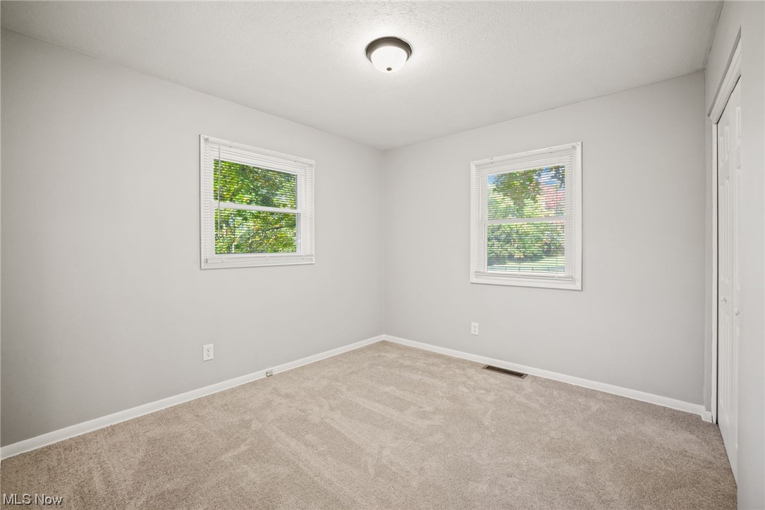 730 East Nimisila Road Uniontown, OH 44685 - Photo 16 of 25 Spare room featuring light carpet