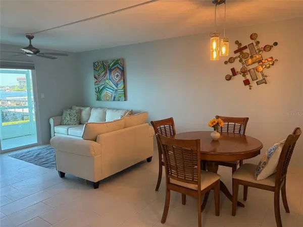 a dining room with furniture and window