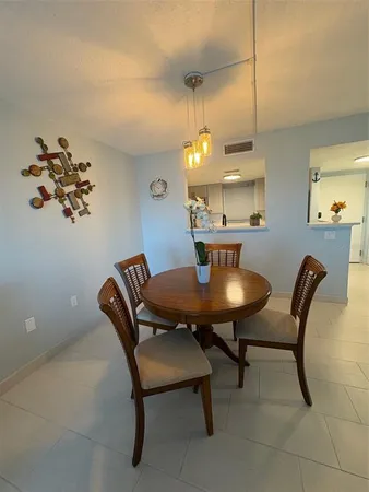 a view of a dining room with furniture