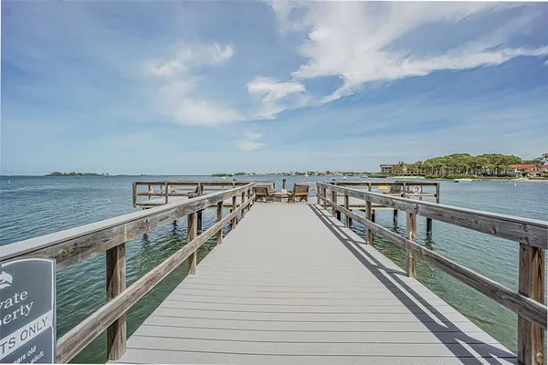 a view of a swimming pool with a lounge chairs