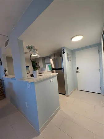 a view of a kitchen with storage and utility