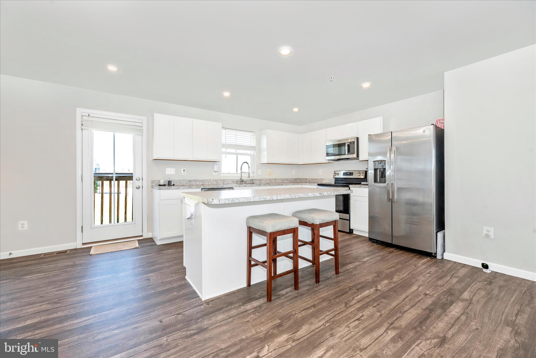 336 Burnside Avenue Taneytown, MD 21787 - Photo 13 of 53 a kitchen with stainless steel appliances a refrigerator a stove top oven and white walls