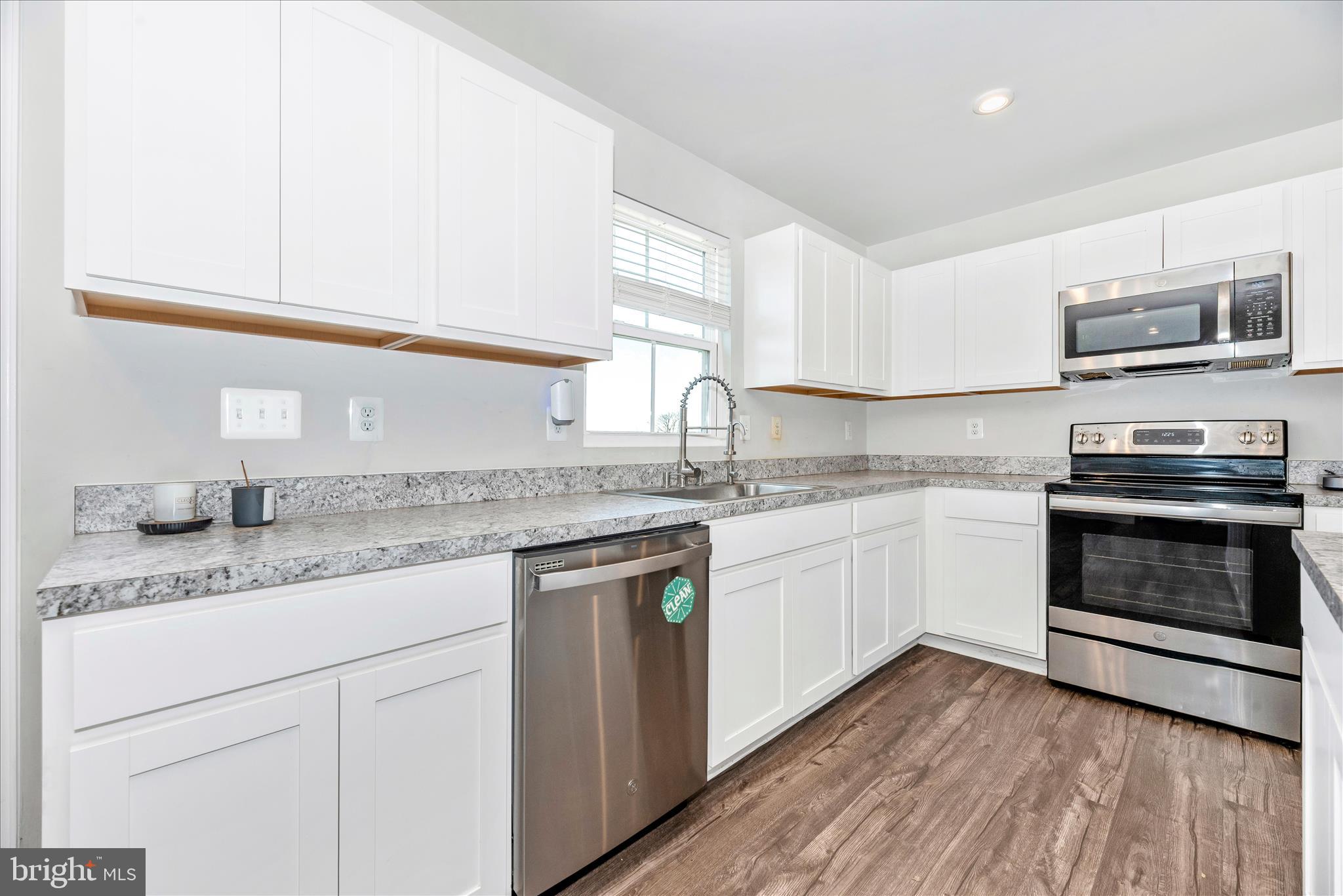 336 Burnside Avenue Taneytown, MD 21787 - Photo 15 of 53 a kitchen with granite countertop cabinets stainless steel appliances and a sink