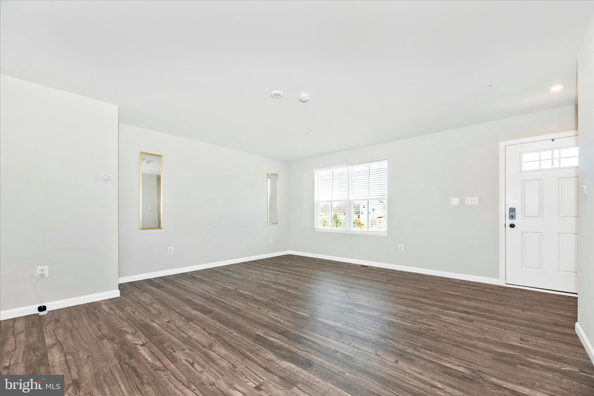 336 Burnside Avenue Taneytown, MD 21787 - Photo 22 of 53 an empty room with wooden floor and windows