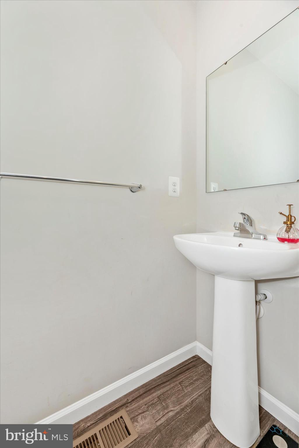 336 Burnside Avenue Taneytown, MD 21787 - Photo 26 of 53 a bathroom with a sink and a mirror