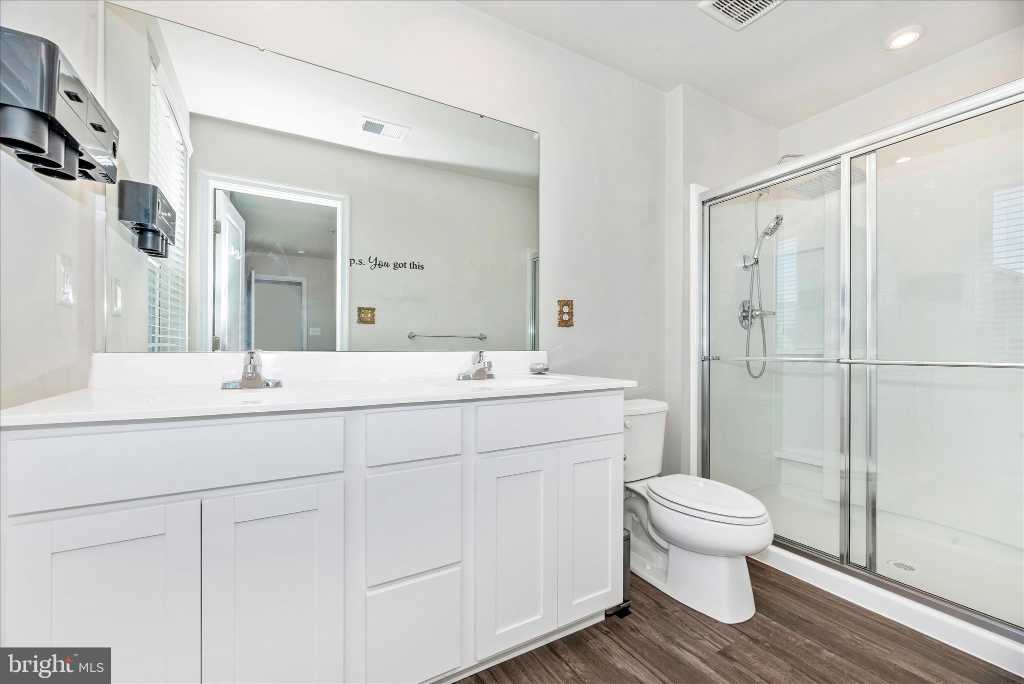 336 Burnside Avenue Taneytown, MD 21787 - Photo 32 of 53 a bathroom with a sink toilet a mirror and shower