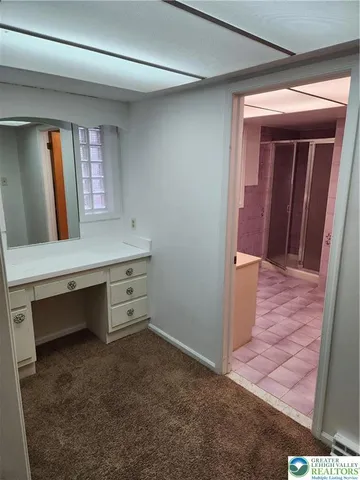 a view of room with window and bathroom