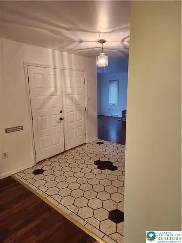 a kitchen with stainless steel appliances granite countertop a sink a stove and wooden cabinets