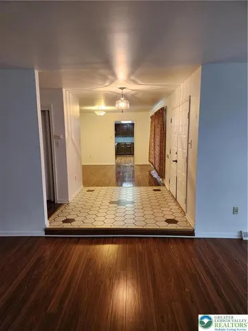 a view of kitchen with wooden floor