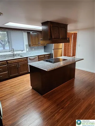 a swimming pool view with a seating space