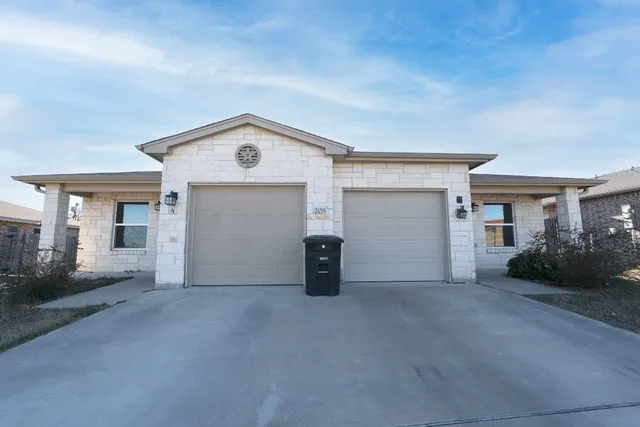 a view of a house with basketball court