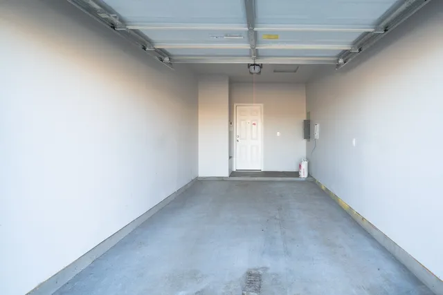 a view of a big room with a ceiling fan