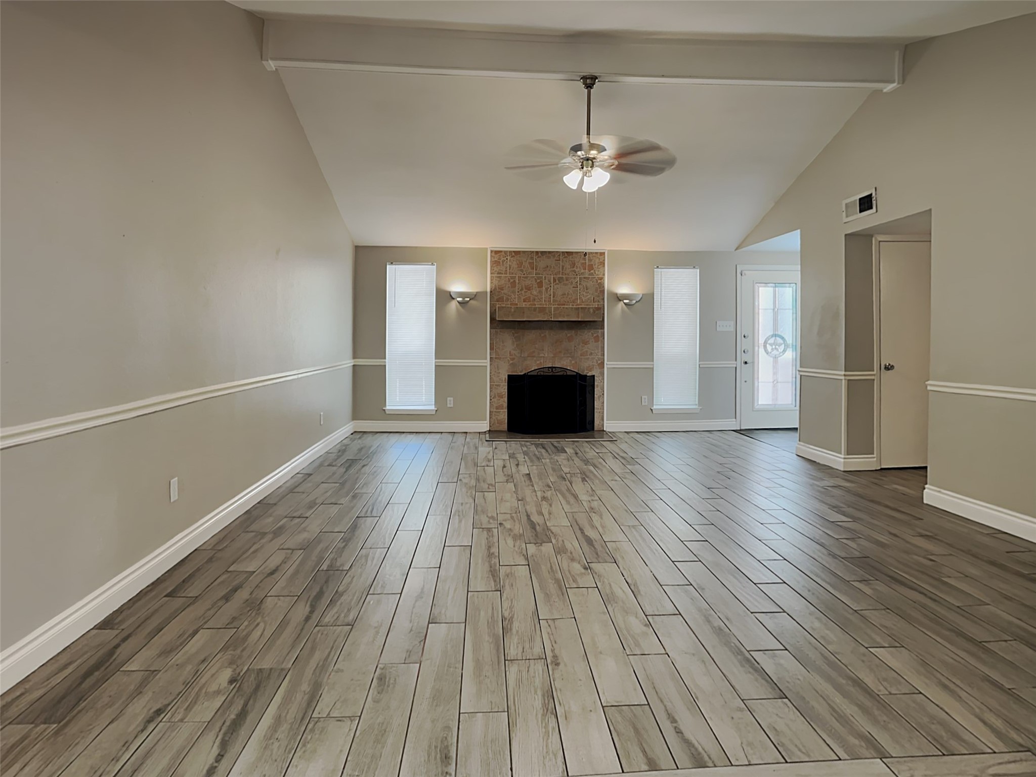 22902 Summer Green Lane Spring, TX 77373 - Photo 2 of 15 a view of an empty room with wooden floor and a window