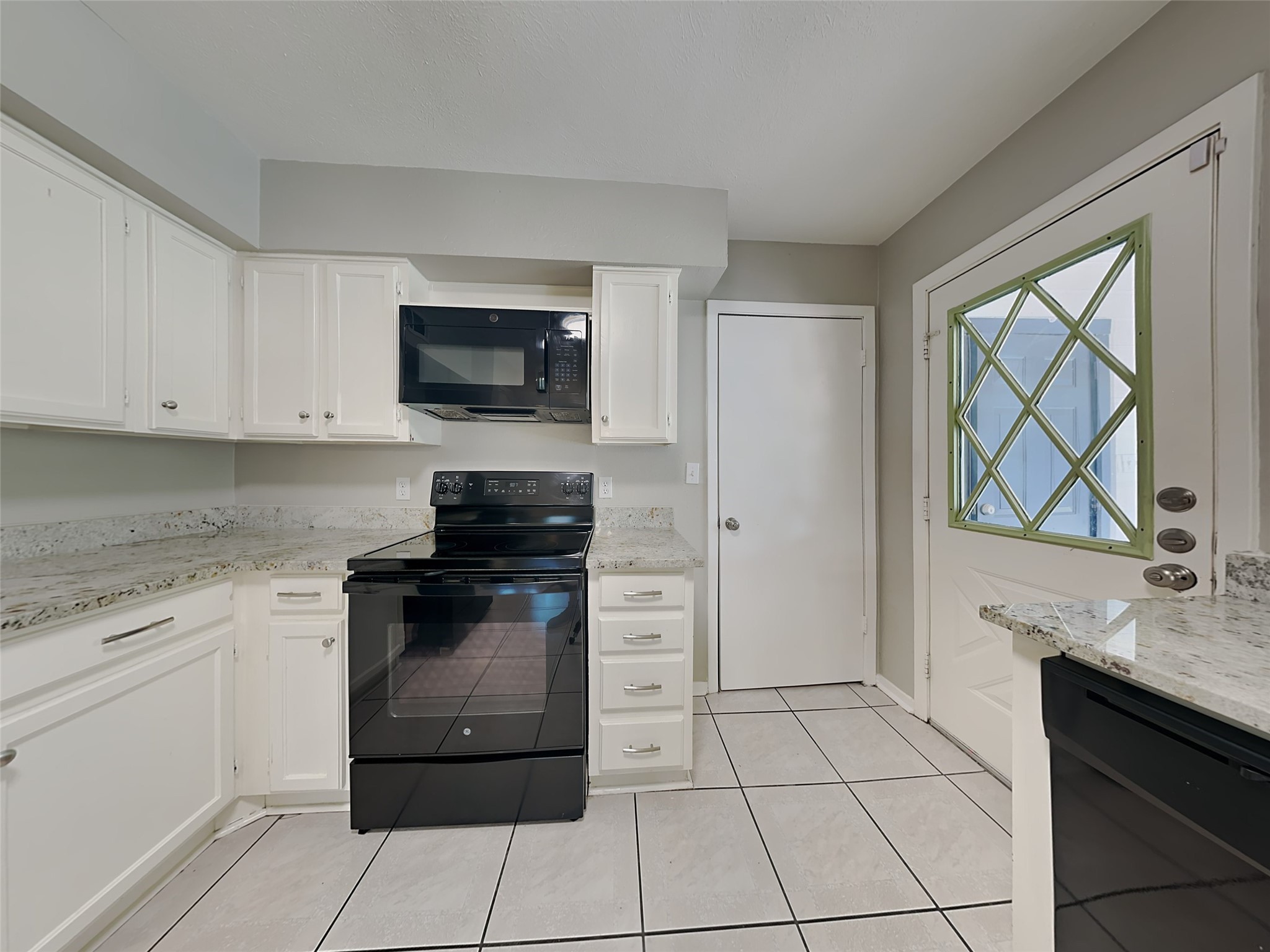 22902 Summer Green Lane Spring, TX 77373 - Photo 3 of 15 a kitchen with a stove top oven and cabinets