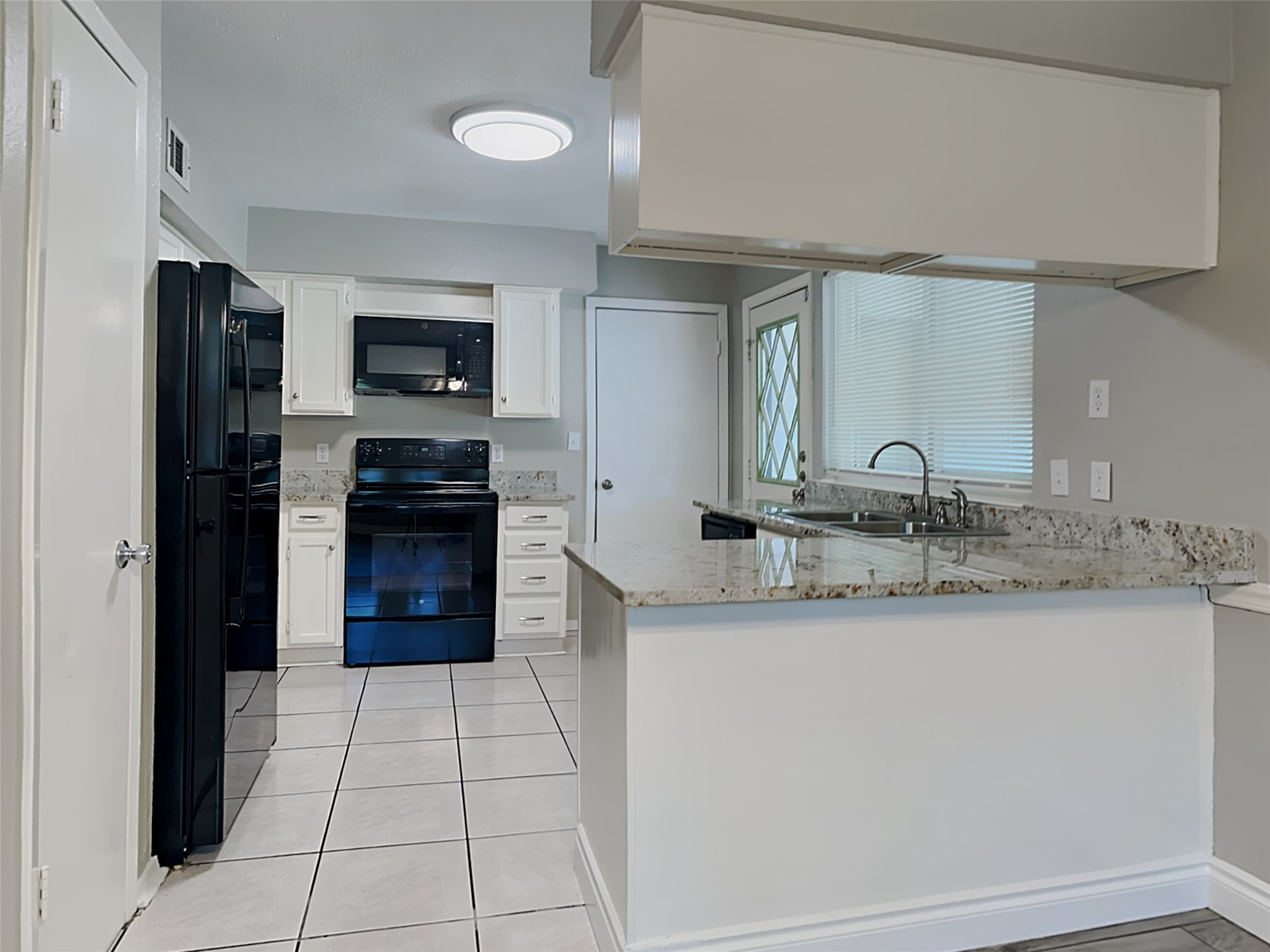 22902 Summer Green Lane Spring, TX 77373 - Photo 4 of 15 a kitchen with stainless steel appliances granite countertop a sink and a stove top oven
