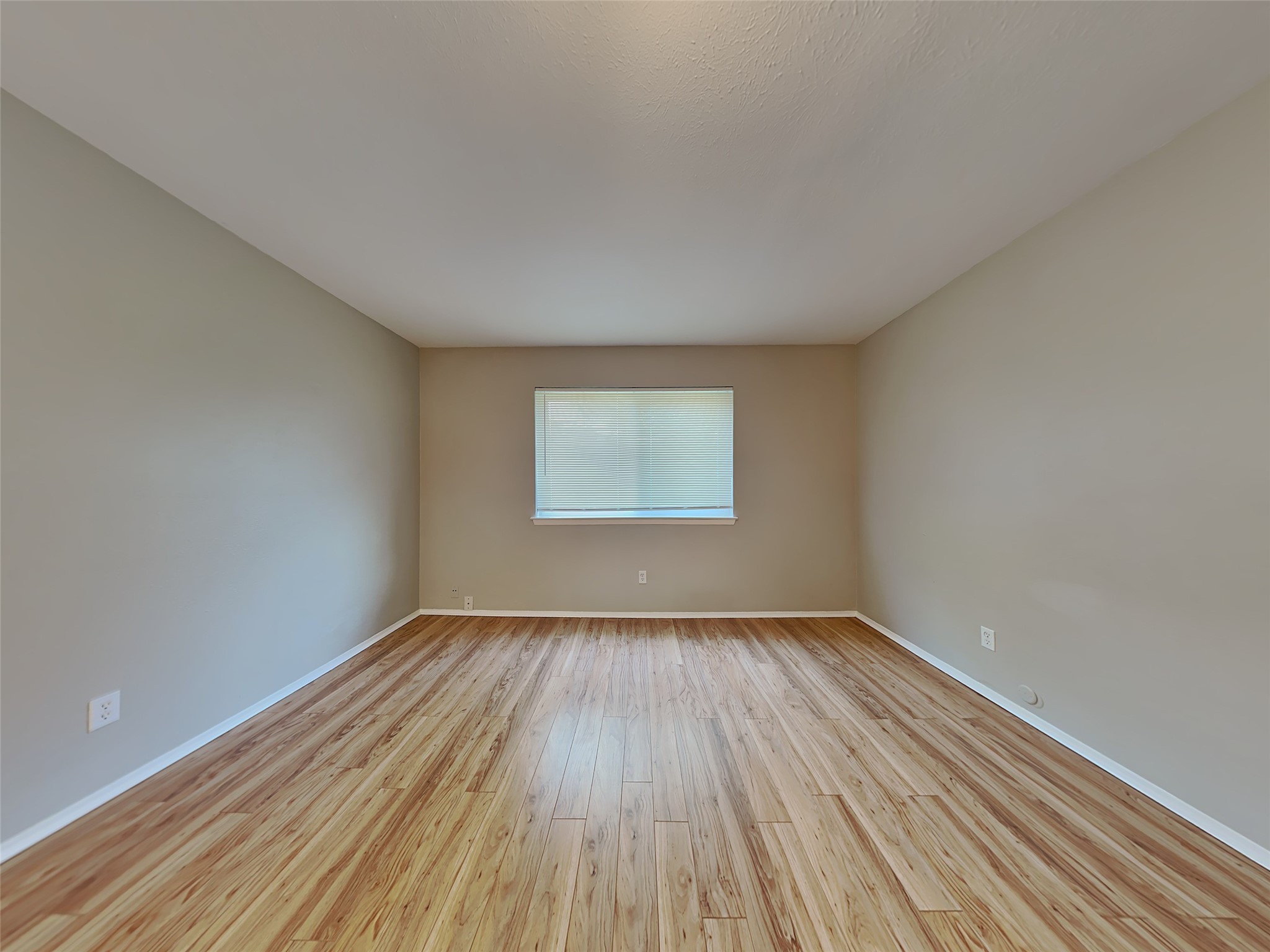 22902 Summer Green Lane Spring, TX 77373 - Photo 6 of 15 a view of an empty room with wooden floor and a window
