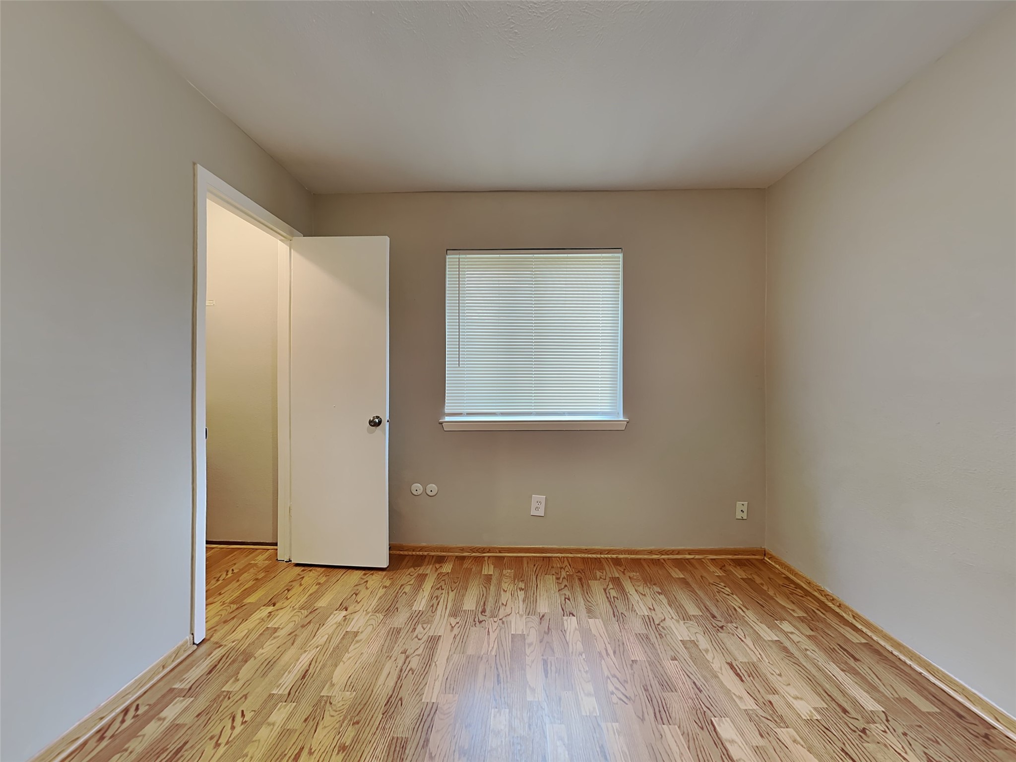 22902 Summer Green Lane Spring, TX 77373 - Photo 9 of 15 an empty room with wooden floor and windows