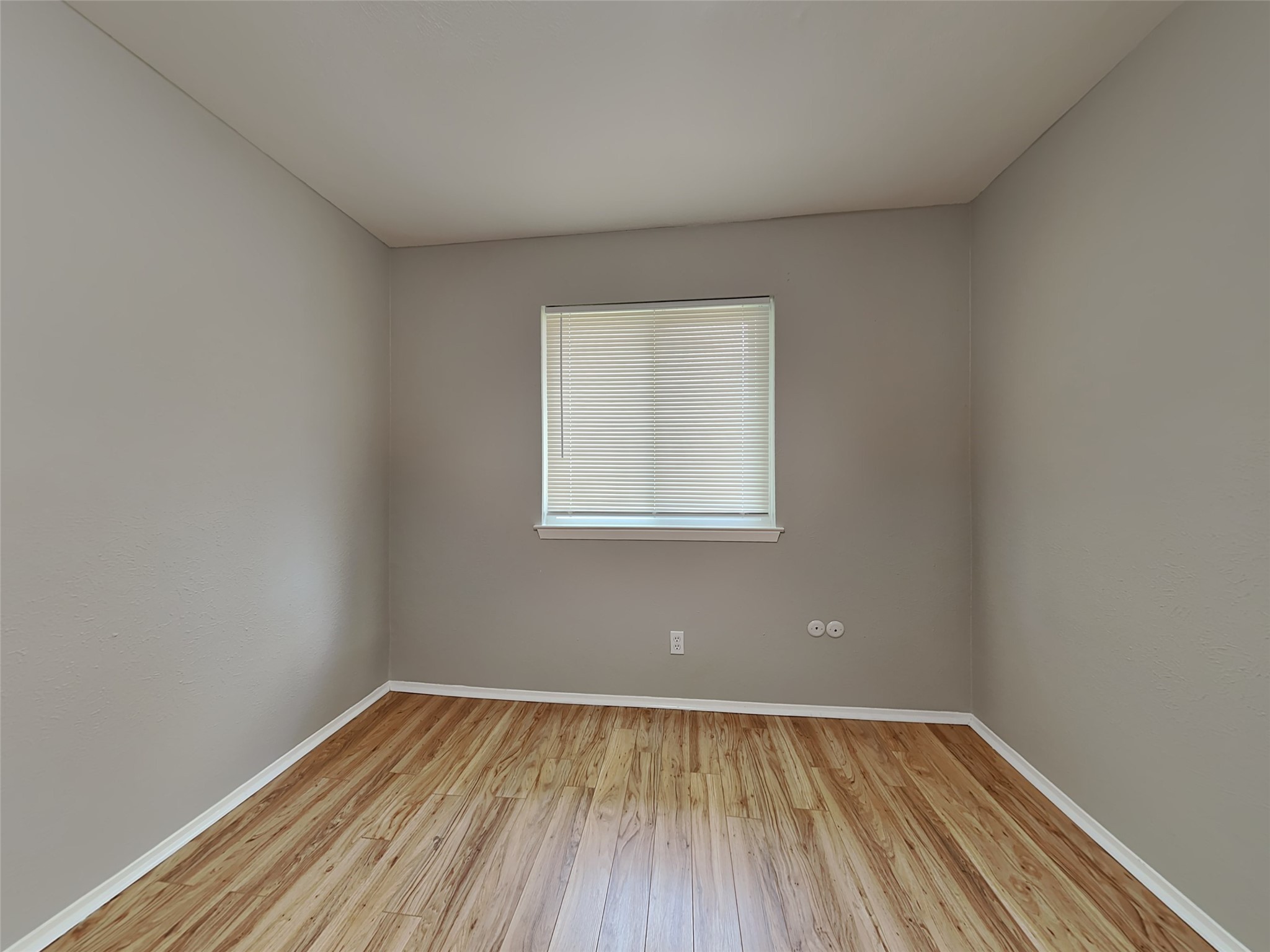 22902 Summer Green Lane Spring, TX 77373 - Photo 10 of 15 a view of an empty room with wooden floor and a window