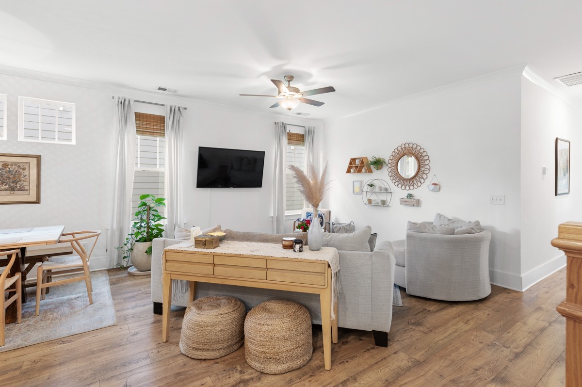 6043 Gracious Drive Franklin, TN 37064 - Photo 11 of 49 a living room with furniture a flat screen tv and a wall clock