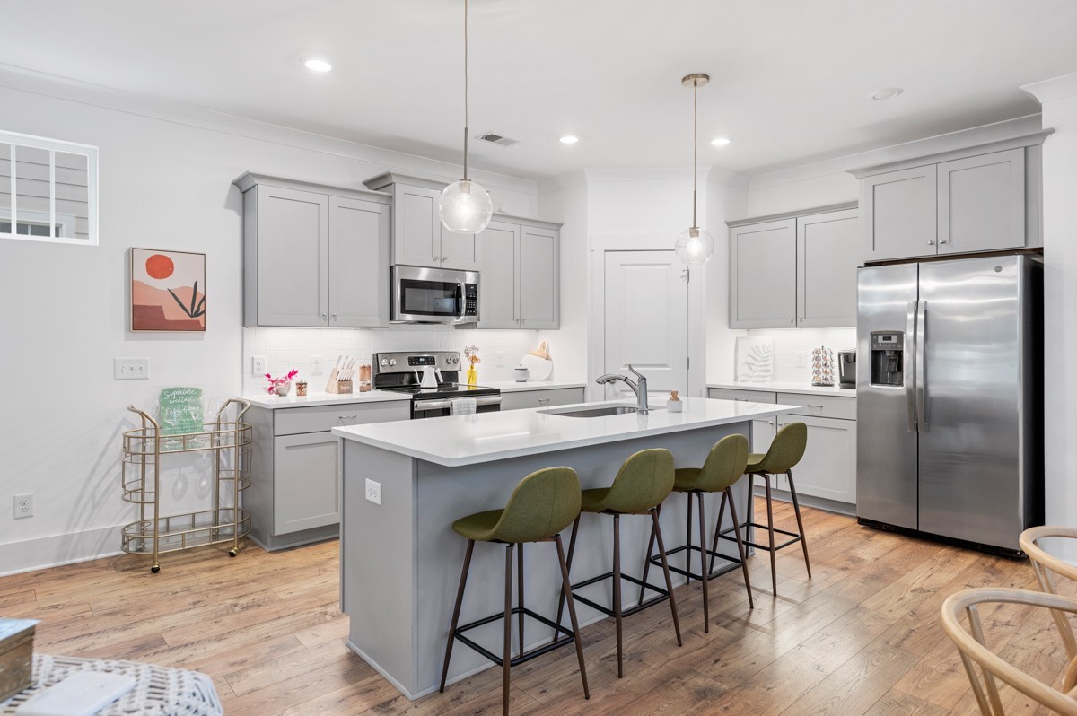 6043 Gracious Drive Franklin, TN 37064 - Photo 16 of 49 a kitchen that has a lot of cabinets a sink a window and stainless steel appliances