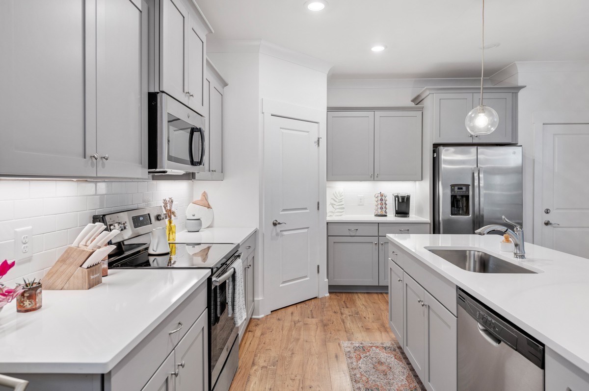 6043 Gracious Drive Franklin, TN 37064 - Photo 18 of 49 a kitchen with a sink cabinets and stainless steel appliances