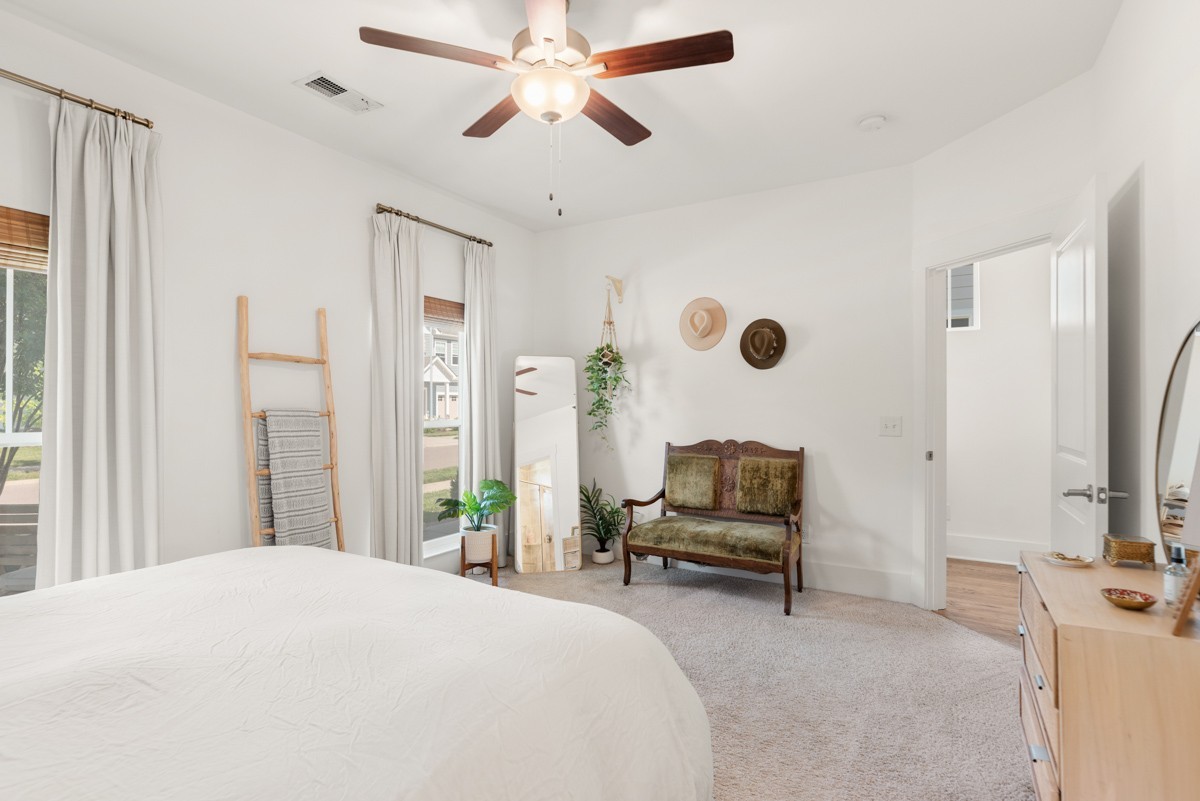 6043 Gracious Drive Franklin, TN 37064 - Photo 25 of 49 a bedroom with a bed and a couch