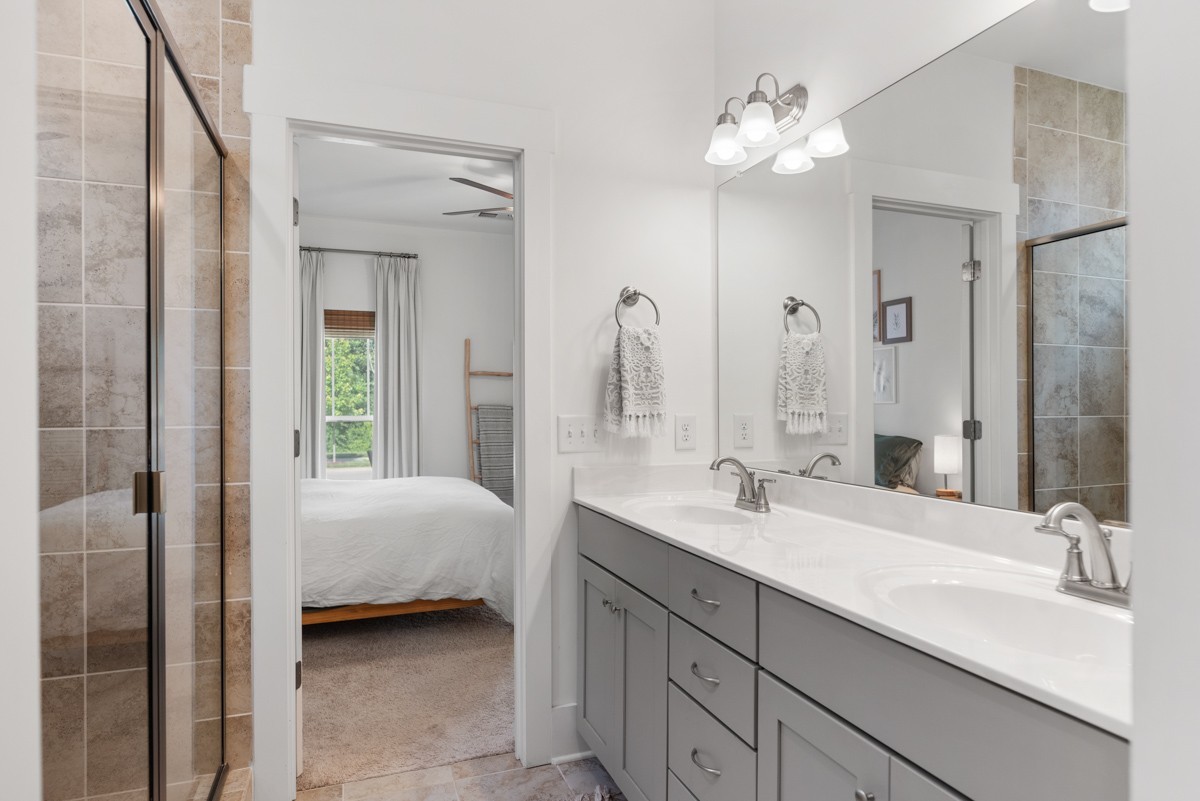 6043 Gracious Drive Franklin, TN 37064 - Photo 27 of 49 a en suite bathroom with a double vanity sink and a mirror