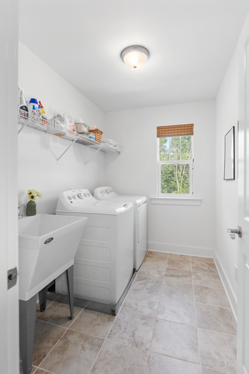 6043 Gracious Drive Franklin, TN 37064 - Photo 35 of 49 a utility room with cabinets dryer and washer