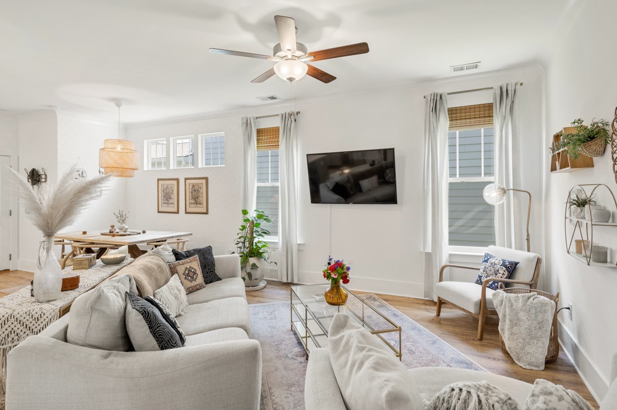 6043 Gracious Drive Franklin, TN 37064 - Photo 10 of 49 a living room with furniture a flat screen tv and a window