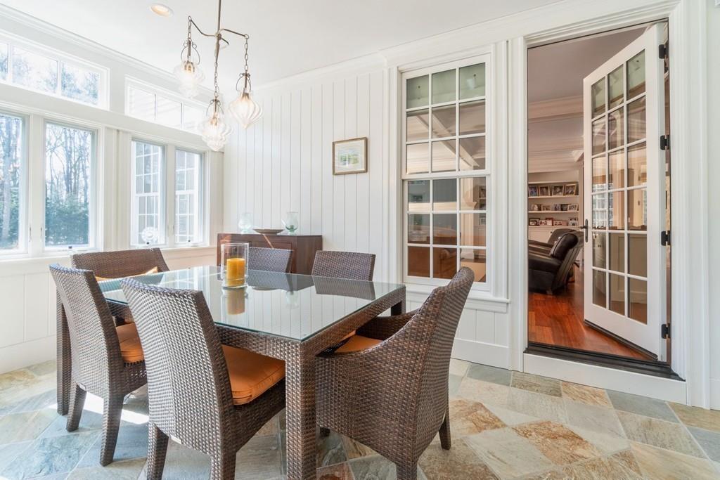 291 Musterfield Road Concord, MA 01742 - Photo 14 of 32 a dining room with furniture a chandelier and window