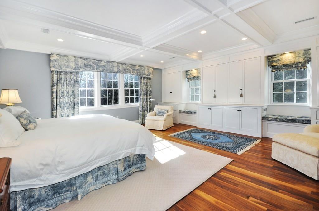 291 Musterfield Road Concord, MA 01742 - Photo 17 of 32 a spacious bedroom with a bed and a large window