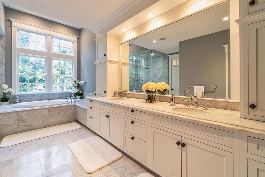 291 Musterfield Road Concord, MA 01742 - Photo 19 of 32 a spacious bathroom with double vanity and a large mirror