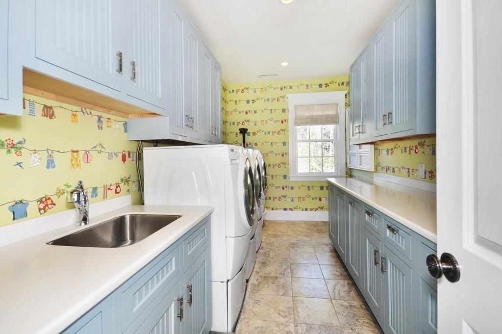 291 Musterfield Road Concord, MA 01742 - Photo 24 of 32 a kitchen with a sink a stove and a refrigerator