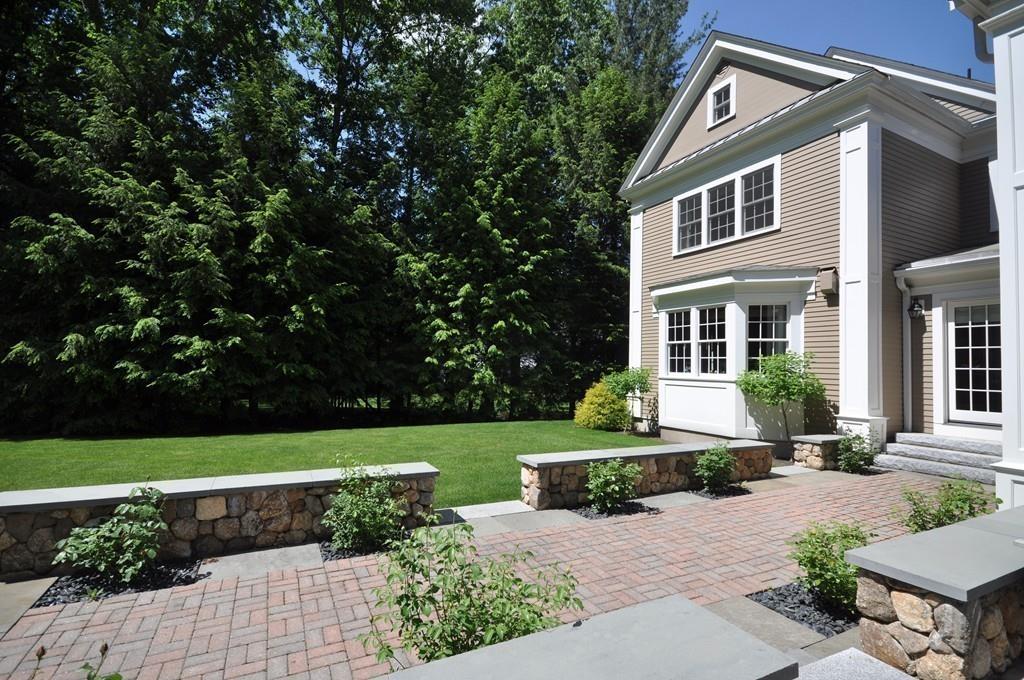 291 Musterfield Road Concord, MA 01742 - Photo 27 of 32 a front view of a house with a yard