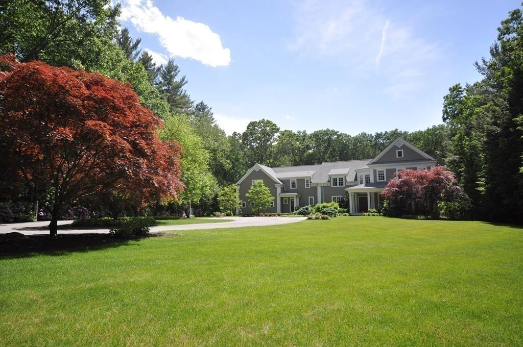 291 Musterfield Road Concord, MA 01742 - Photo 29 of 32 a front view of a house with a yard and trees