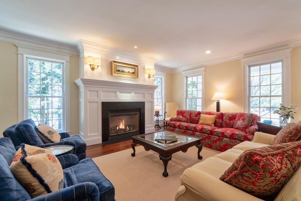 291 Musterfield Road Concord, MA 01742 - Photo 5 of 32 a living room with furniture and a fireplace