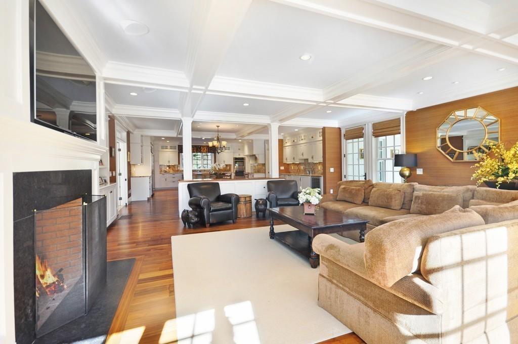 291 Musterfield Road Concord, MA 01742 - Photo 6 of 32 a living room with fireplace furniture and a flat screen tv