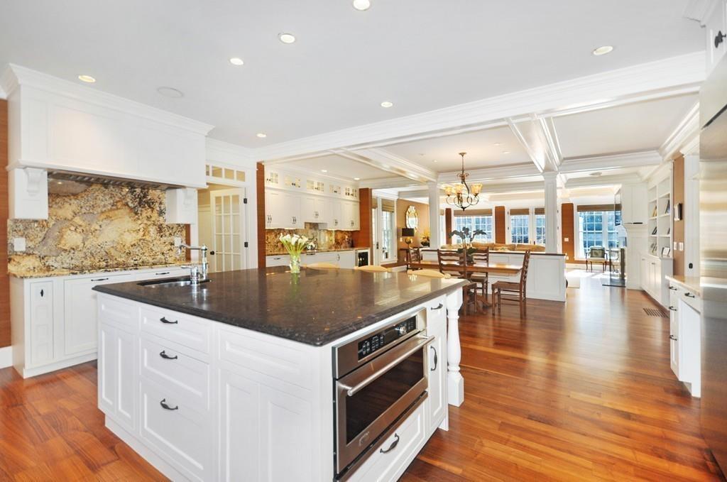 291 Musterfield Road Concord, MA 01742 - Photo 8 of 32 a kitchen with stainless steel appliances granite countertop a lot of counter space and wooden floors