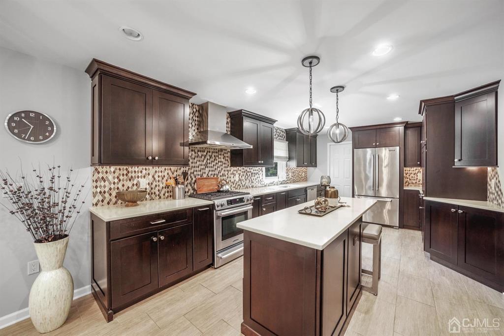 19 Mary Ellen Drive Edison, NJ 08820 - Photo 11 of 36 a kitchen with a sink stove and refrigerator