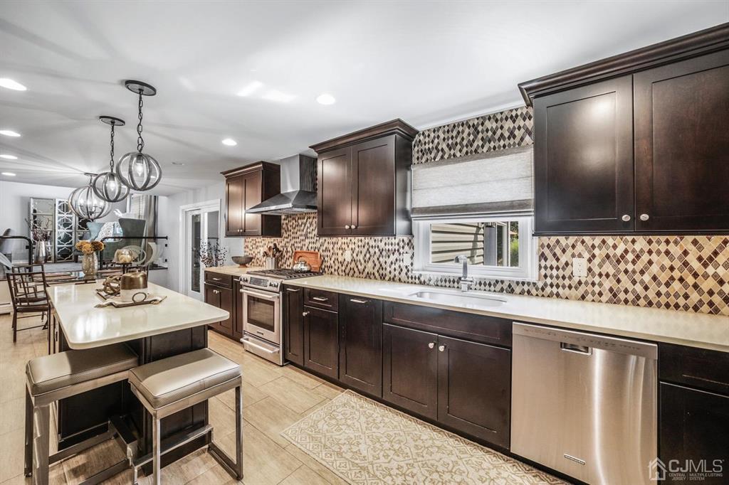 19 Mary Ellen Drive Edison, NJ 08820 - Photo 13 of 36 a kitchen with stainless steel appliances kitchen island granite countertop a sink and cabinets