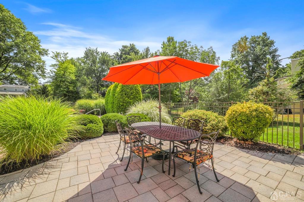 19 Mary Ellen Drive Edison, NJ 08820 - Photo 20 of 36 an outdoor space with furniture and umbrella