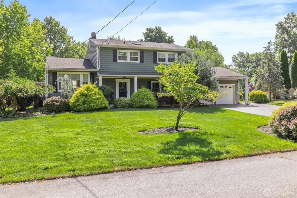 19 Mary Ellen Drive Edison, NJ 08820 - Photo 2 of 36 a front view of a house with a yard
