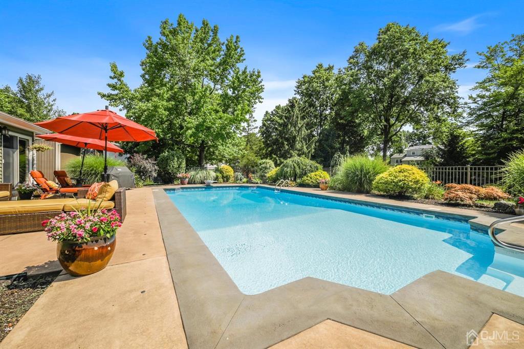 19 Mary Ellen Drive Edison, NJ 08820 - Photo 22 of 36 a view of a swimming pool with a patio